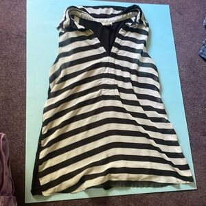 A medium sized black-and-white striped blouse with a collar and black backing